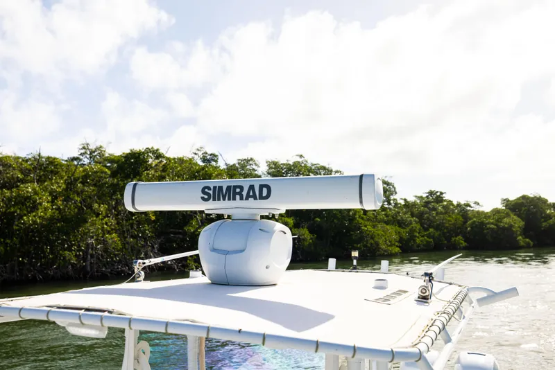 Slide: The Image of Radar system on 2006 Contender 33 Tournament boat, cruising through lush waterway. - 34