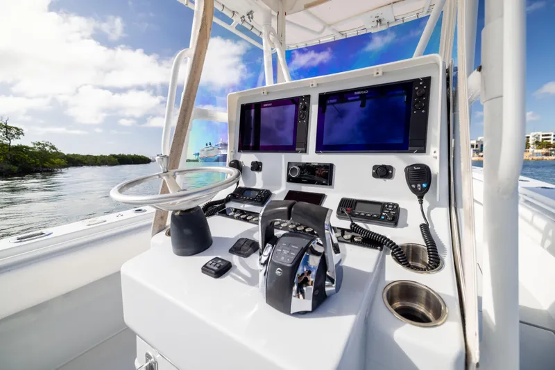 Slide: The Image of 2006 Contender 33 Tournament boat cockpit with dual screens and controls. - 41