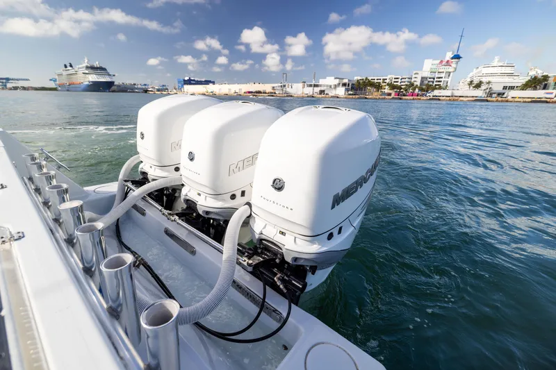 Slide: The Image of 2006 Contender 33 Tournament boat with triple Mercury outboard engines on the water. - 45