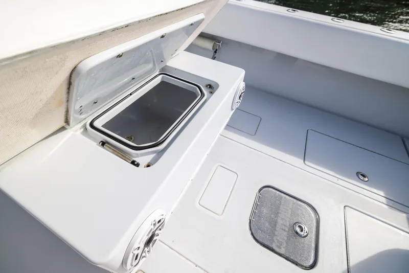 Slide: The Image of 2006 Contender 33 Tournament boat deck with storage compartments and speaker. - 49