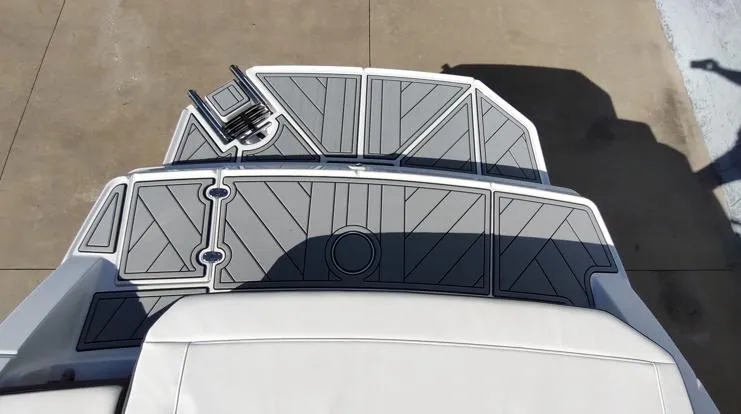 Slide: The Image of 2025 Monterey M-225 boat deck with modern gray design and seating area. - 13