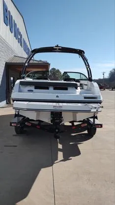 Slide: The Image of 2025 Monterey M-225 boat on trailer, parked outdoors near a building. - 15