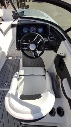 Slide: The Image of 2025 Monterey M-225 boat cockpit with modern steering wheel and dashboard controls. - 5