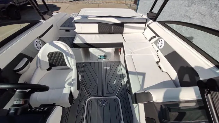 Slide: The Image of 2025 Monterey M-225 boat interior with white seating and modern design. - 7