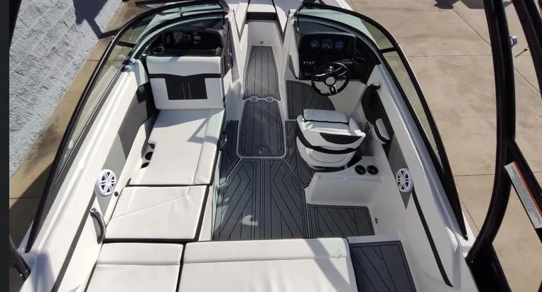 Slide: The Image of 2025 Monterey M-225 boat interior with sleek seating and modern dashboard design. - 9