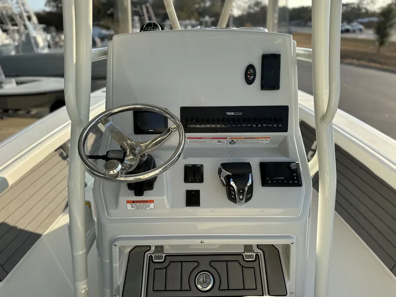 Slide: The Image of 2025 Pathfinder 2400 Open boat console with steering wheel and controls. - 18