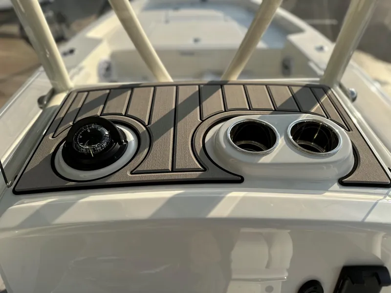 Slide: The Image of 2025 Pathfinder 2400 Open boat console with compass and cup holders. - 19