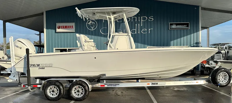 Slide: The Image of 2025 Pathfinder 2400 Open boat on trailer at dealership. - 2