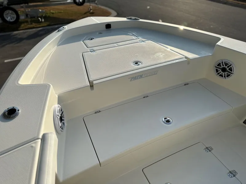 Slide: The Image of 2025 Pathfinder 2400 Open boat deck with storage compartments and speakers. - 22