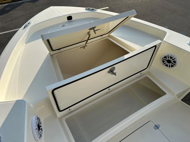 Slide: The Image of 2025 Pathfinder 2400 Open boat storage compartments with open hatches, showcasing spacious interior design. - 23