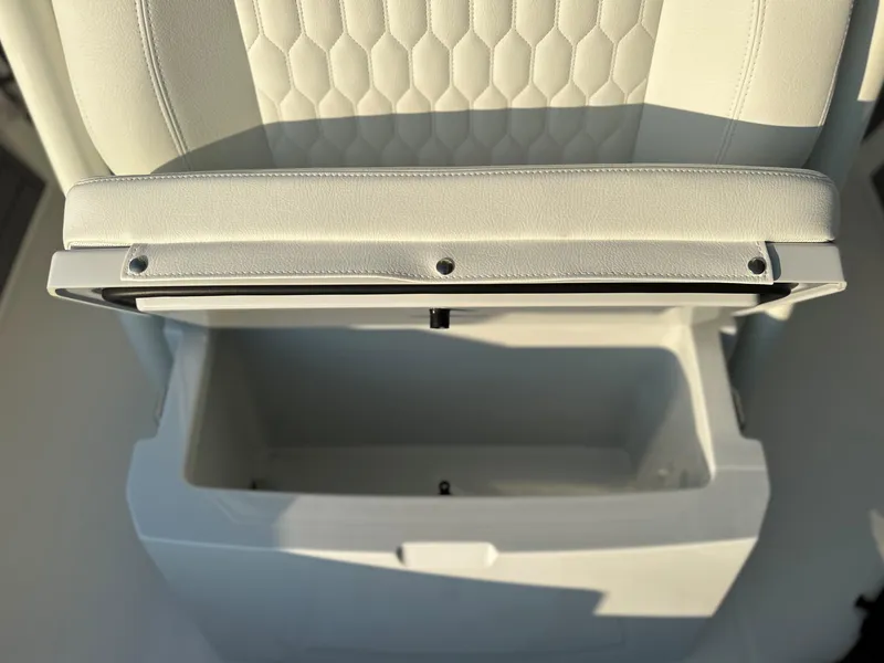 Slide: The Image of Open storage compartment on 2025 Pathfinder 2400 Open boat with cushioned seat. - 26