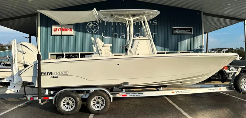 Slide: The Image of 2025 Pathfinder 2400 Open boat on trailer, parked at dealership. - 27