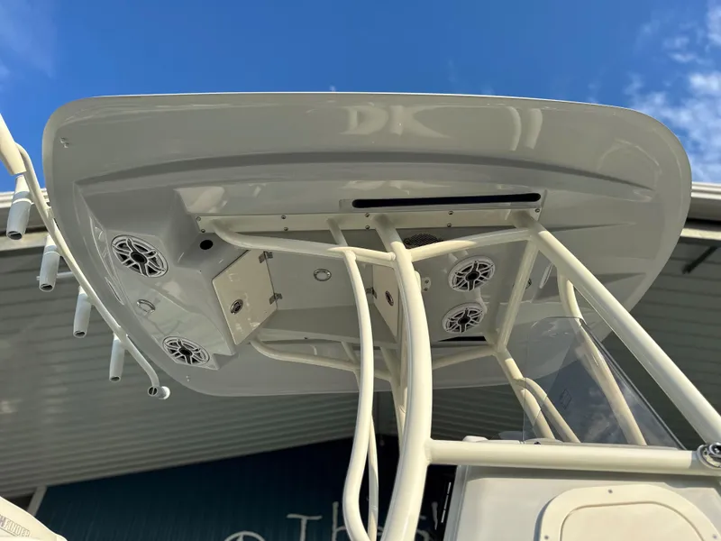 Slide: The Image of 2025 Pathfinder 2400 Open boat top view with speakers and rod holders. - 30