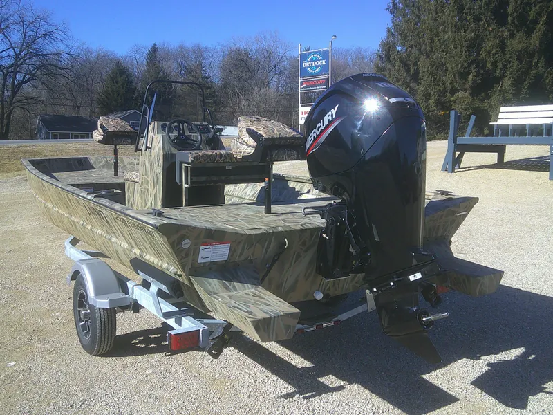 Slide: The Image of 2025 Lund 2070 Predator CC boat with Mercury outboard motor on a trailer. - 11