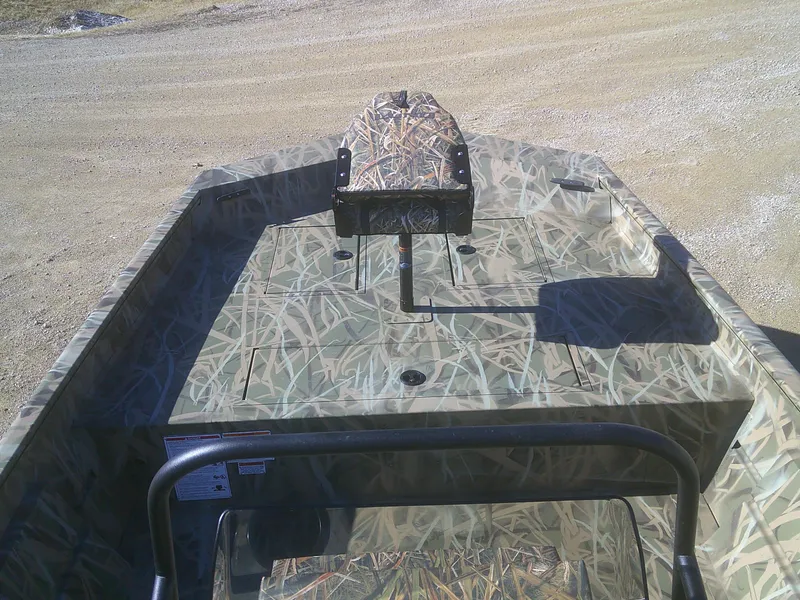 Slide: The Image of 2025 Lund 2070 Predator CC boat with camouflage design, viewed from the interior. - 3