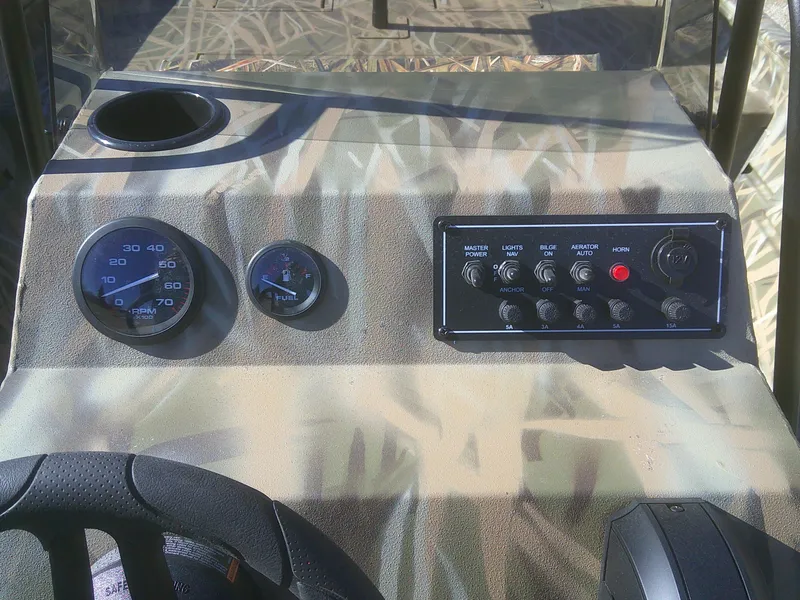 Slide: The Image of Dashboard of 2025 Lund 2070 Predator CC boat with gauges and controls. - 8