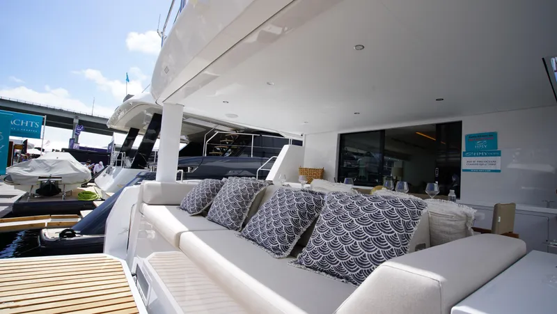 Slide: The Image of Luxury Two Oceans 555 - 008 catamaran yacht cruising in clear blue waters, 2025 model. - 1