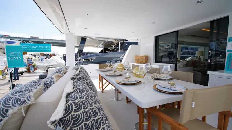 Slide: The Image of Luxury Two Oceans 555 - 008 yacht cruising near tropical shoreline, 2025 model. - 2