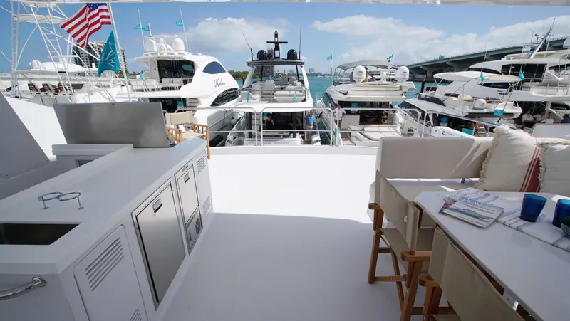 Slide: The Image of Modern yacht interior with wooden flooring, stairs, and a cozy bedroom. Two Oceans 555 - 008, 2025. - 23