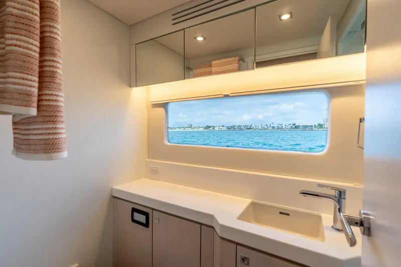 Slide: The Image of Modern yacht bathroom with ocean view, featuring sleek design and contemporary fixtures. - 26