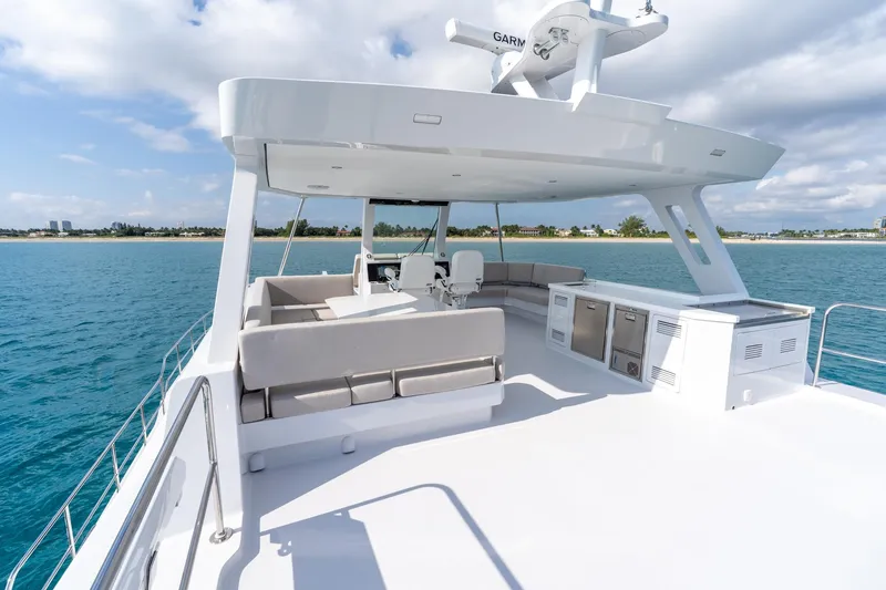 Slide: The Image of Luxurious 2025 Two Oceans 555-008 yacht deck with seating, ocean view, and modern amenities. - 40