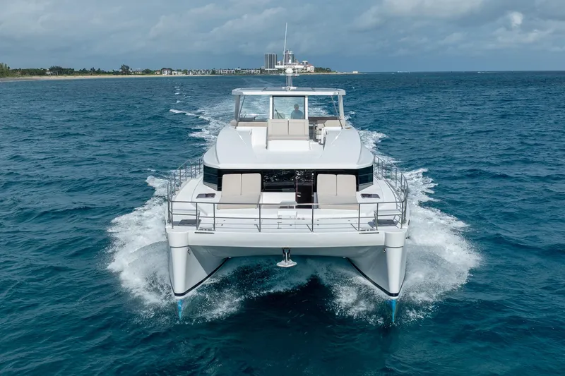 Slide: The Image of Luxury Two Oceans 555 - 008 catamaran cruising on open sea, 2025 model. - 59