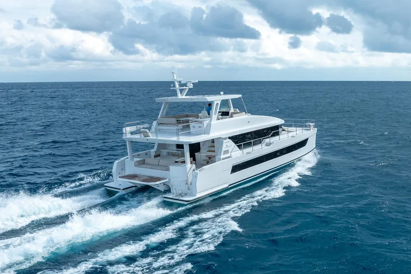 Slide: The Image of Luxurious 2025 Two Oceans 555 - 008 yacht cruising on open sea under cloudy skies. - 62