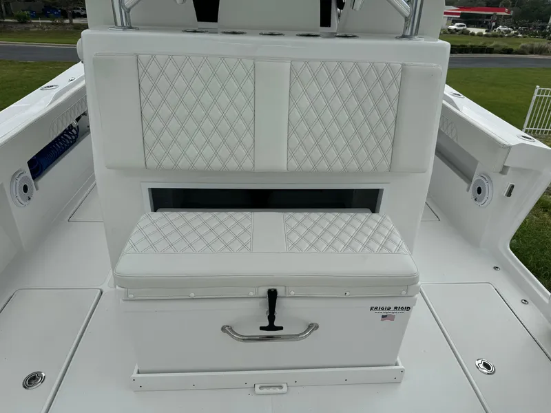 Slide: The Image of 2023 Front Runner 36 Center Console boat with white cushioned seating and storage. - 11