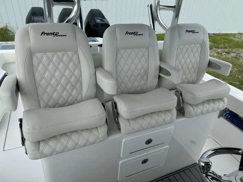 Slide: The Image of 2023 Front Runner 36 Center Console boat seats with diamond stitching and armrests. - 15