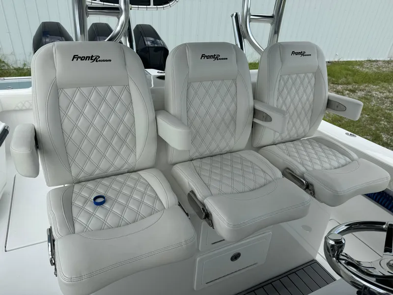 Slide: The Image of 2023 Front Runner 36 Center Console boat seats with diamond stitching and armrests. - 16