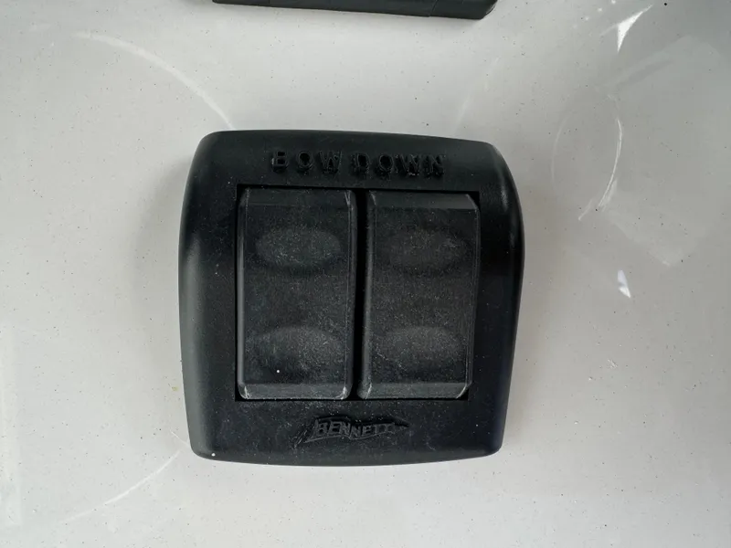 Slide: The Image of Black dual switch panel on 2023 Front Runner 36 Center Console boat. - 21