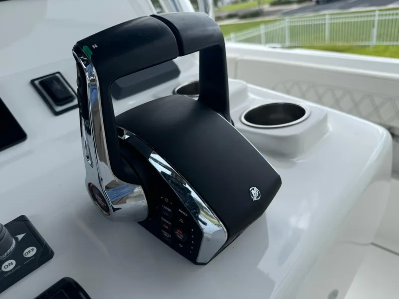 Slide: The Image of Throttle control on 2023 Front Runner 36 Center Console boat dashboard. - 22