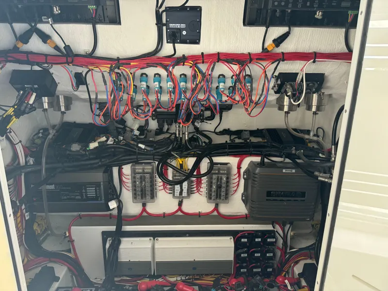 Slide: The Image of Electrical wiring and components inside a 2023 Front Runner 36 Center Console boat. - 26