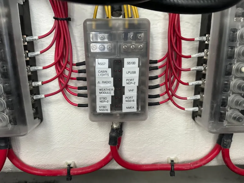 Slide: The Image of Electrical panel with labeled wires in a 2023 Front Runner 36 Center Console boat. - 29