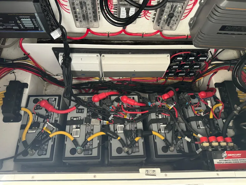 Slide: The Image of 2023 Front Runner 36 Center Console battery compartment with wiring and electrical components. - 30