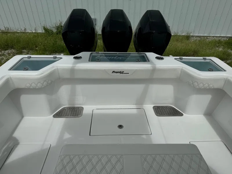 Slide: The Image of 2023 Front Runner 36 Center Console boat with triple outboard engines. - 7