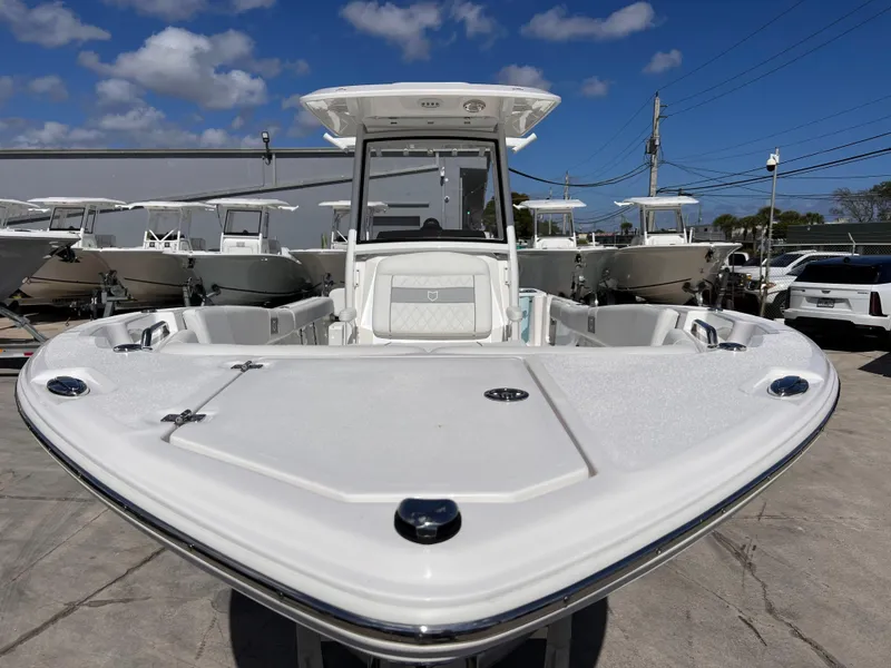 Slide: The Image of 2025 Sea Fox 268 Commander boat, front view, docked under a clear blue sky. - 10