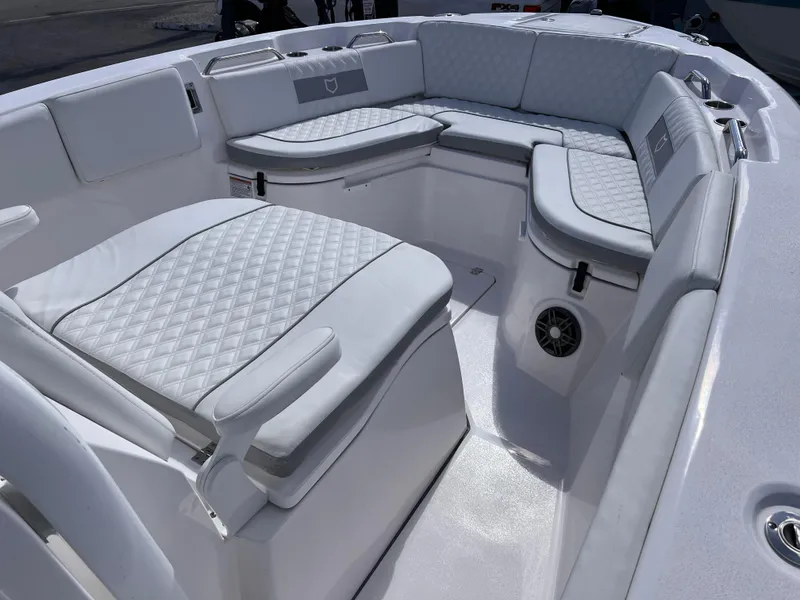 Slide: The Image of 2025 Sea Fox 268 Commander boat interior with white cushioned seating and speaker. - 14