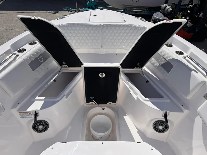Slide: The Image of 2025 Sea Fox 268 Commander boat interior with open storage compartments and speakers. - 15