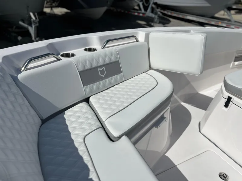 Slide: The Image of 2025 Sea Fox 268 Commander boat interior with cushioned seating and cup holders. - 20