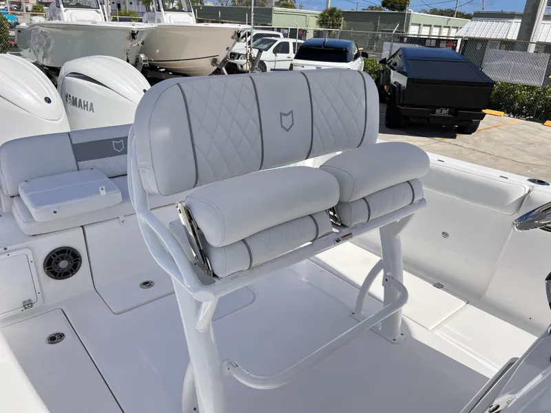 Slide: The Image of 2025 Sea Fox 268 Commander boat interior with cushioned seating and Yamaha engines. - 21