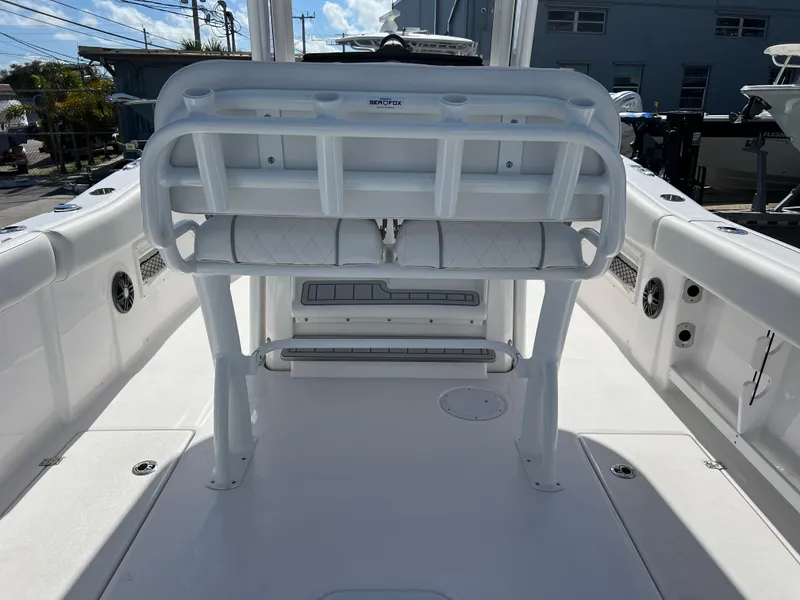 Slide: The Image of 2025 Sea Fox 268 Commander boat interior with white seating and storage compartments. - 23