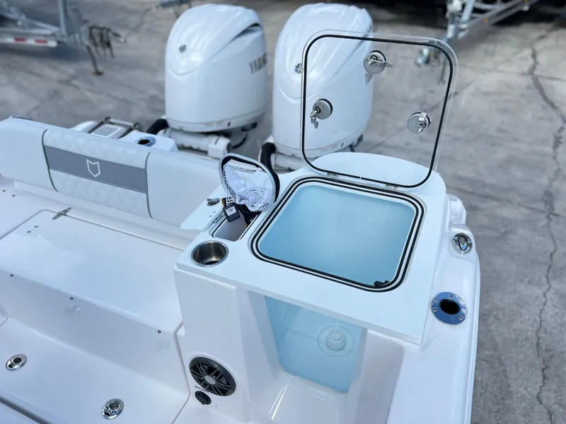 Slide: The Image of 2025 Sea Fox 268 Commander boat with open storage compartment and dual Yamaha engines. - 30