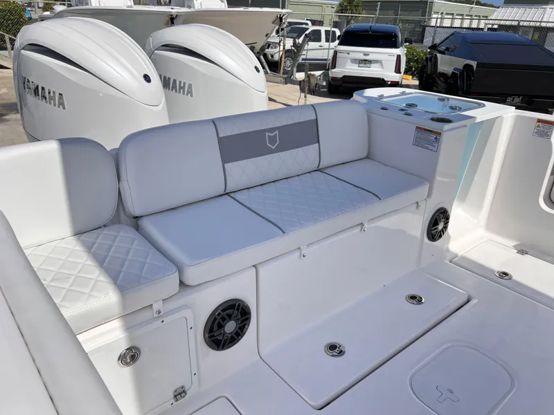 Slide: The Image of 2025 Sea Fox 268 Commander boat interior with white seating and Yamaha engines. - 32