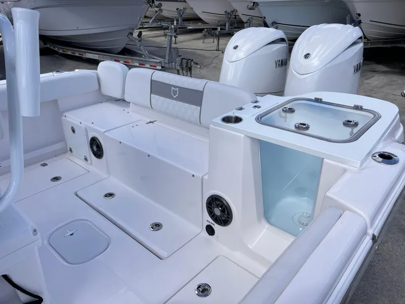 Slide: The Image of 2025 Sea Fox 268 Commander boat interior with Yamaha engines, featuring seating and storage compartments. - 33