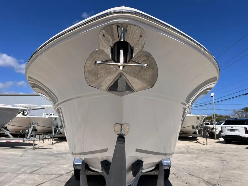 Slide: The Image of 2025 Sea Fox 268 Commander boat front view in a marina setting. - 9