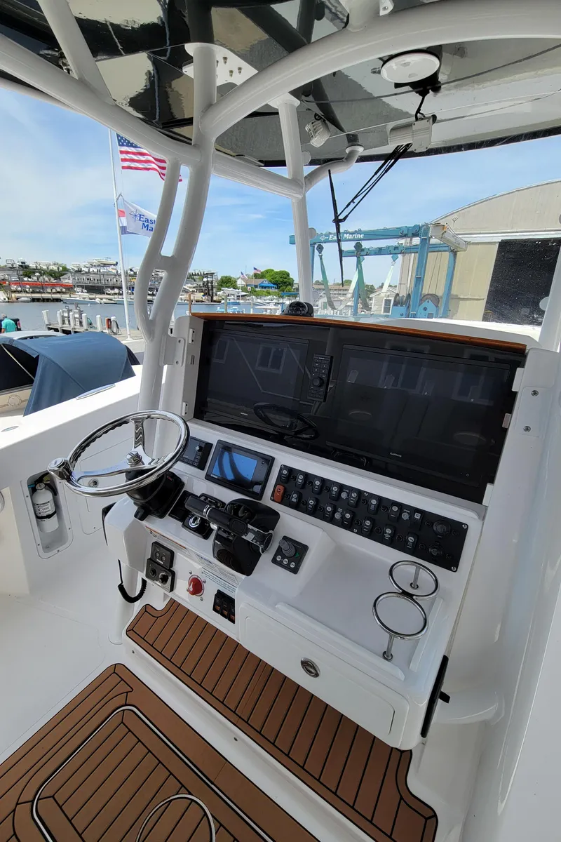 Slide: The Image of 2020 Southport 33 FE boat helm with advanced navigation controls and steering wheel. - 10
