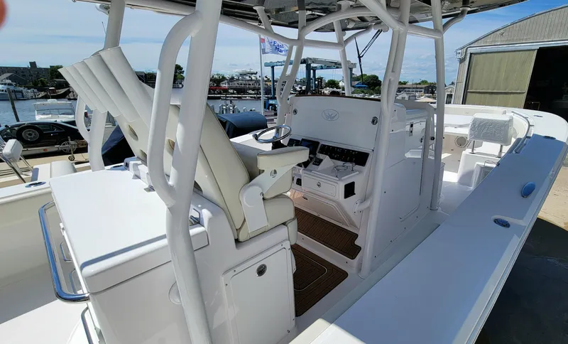 Slide: The Image of 2020 Southport 33 FE boat interior with helm and seating area. - 11