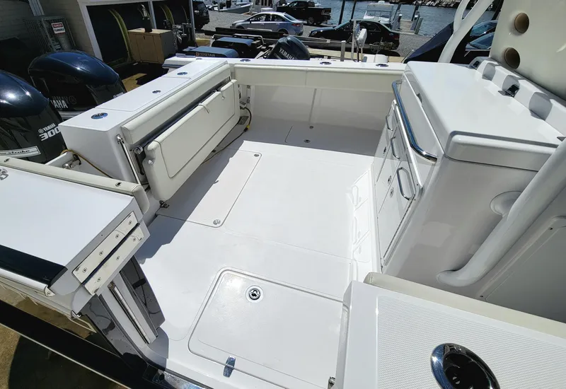 Slide: The Image of 2020 Southport 33 FE boat deck with storage and seating. - 13