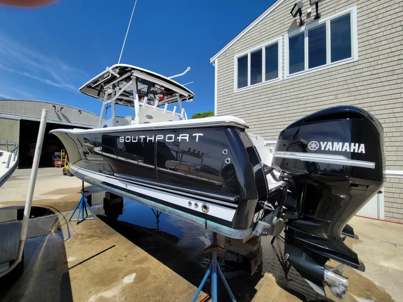 Slide: The Image of 2020 Southport 33 FE boat with Yamaha engines on display outdoors. - 5